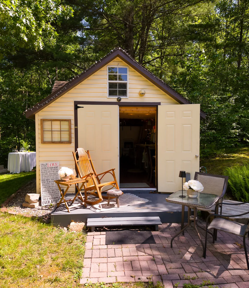 The yellow Bridal Suite cottage with its doors open